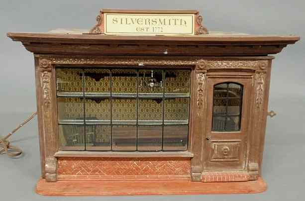 Appraisal: Metal and wood toy Colonial Silversmith Shop with miniature metal