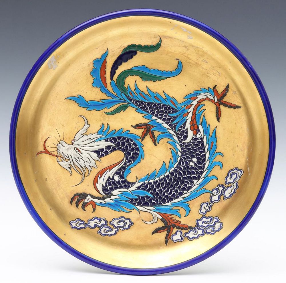 Appraisal: A FRENCH ART POTTERY CHARGER WITH DRAGON IN ENAMELS The