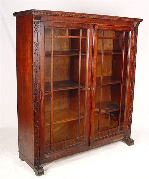 Appraisal: OAK DOOR BOOKCASE Early th C oak bookcase with Greek