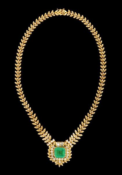 Appraisal: karat yellow gold emerald and diamond necklace Eighty-six tapering leaf