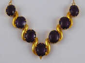 Appraisal: A yellow metal tests carat gold amethyst necklace the largest