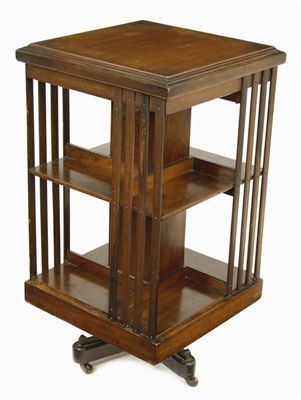 Appraisal: An Edwardian walnut revolving bookcase in cm h in cm