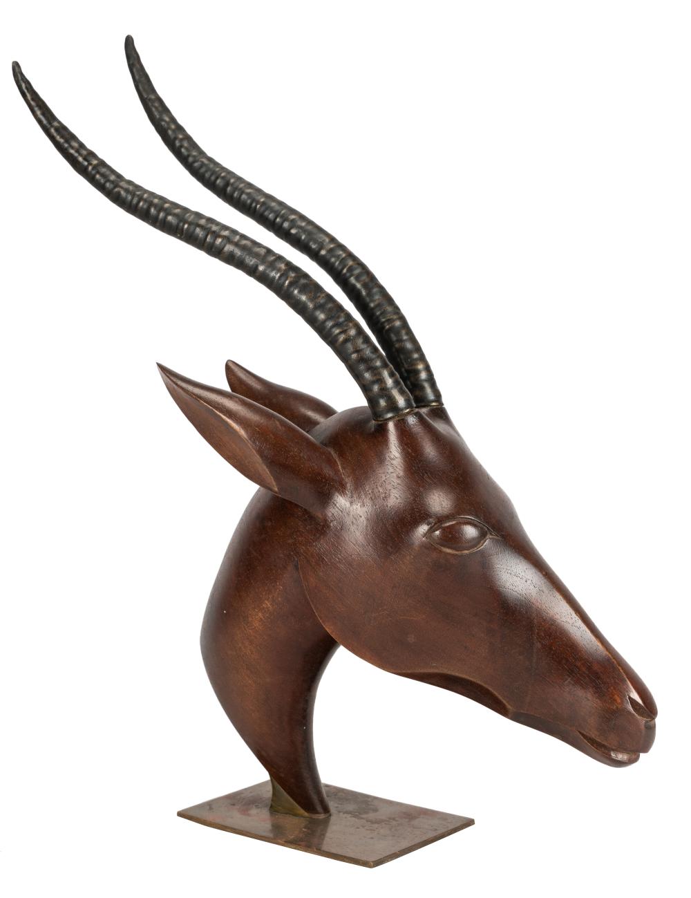 Appraisal: HAGENAUER HEAD OF A GAZELLEcarved wood and patinated metal mounted