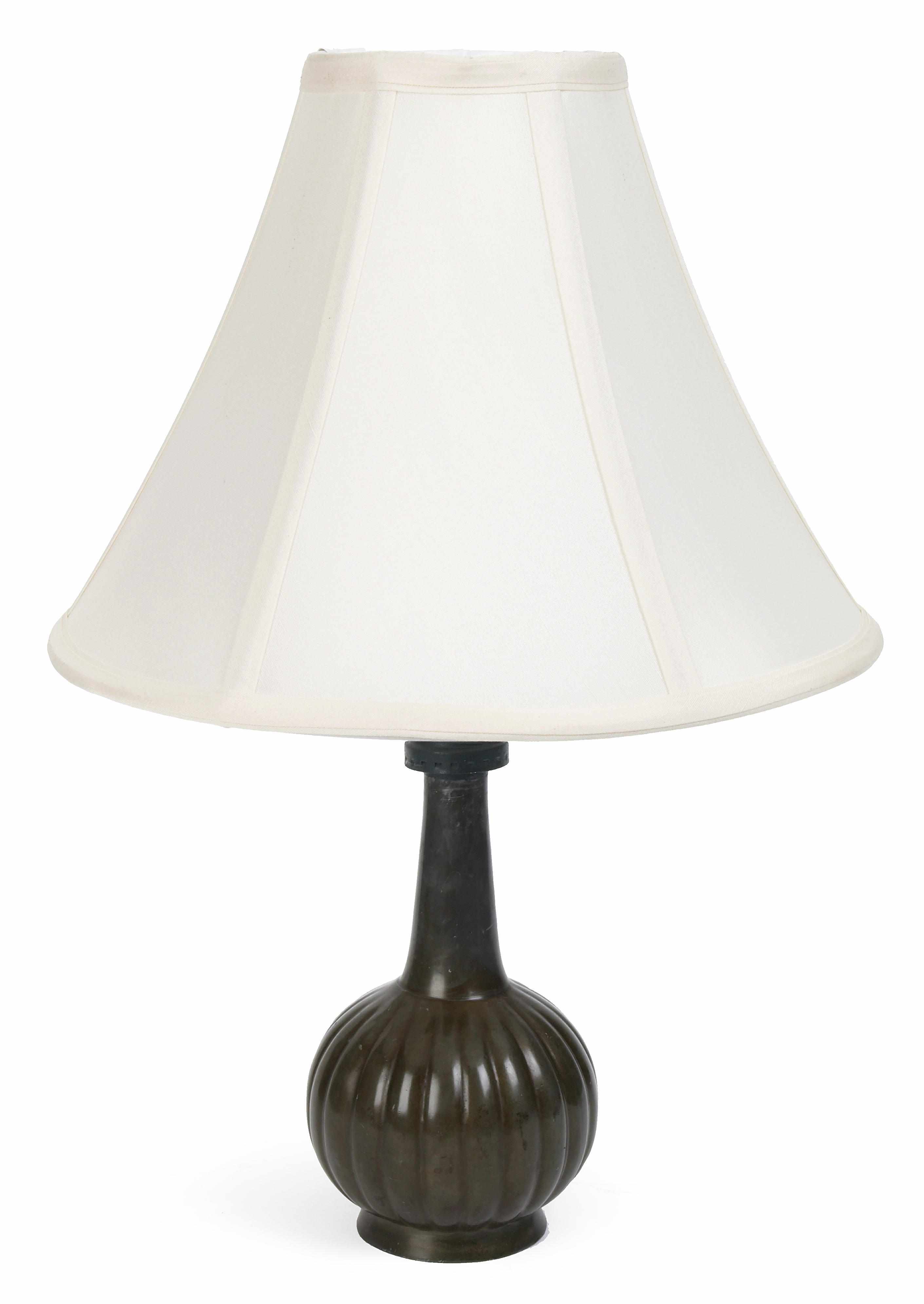 Appraisal: A Just Andersen diskometal table lamp sstamped JUST within a