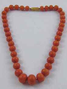 Appraisal: A fine graduated coral bead necklace the largest bead measuring