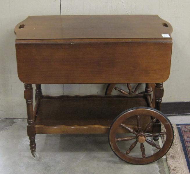 Appraisal: WALNUT DROP-LEAF TEA CART American th century a rectangular -tier