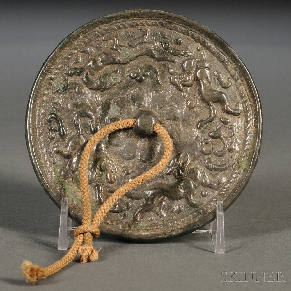 Appraisal: Bronze Mirror China possibly Tang Dynasty cast with a central