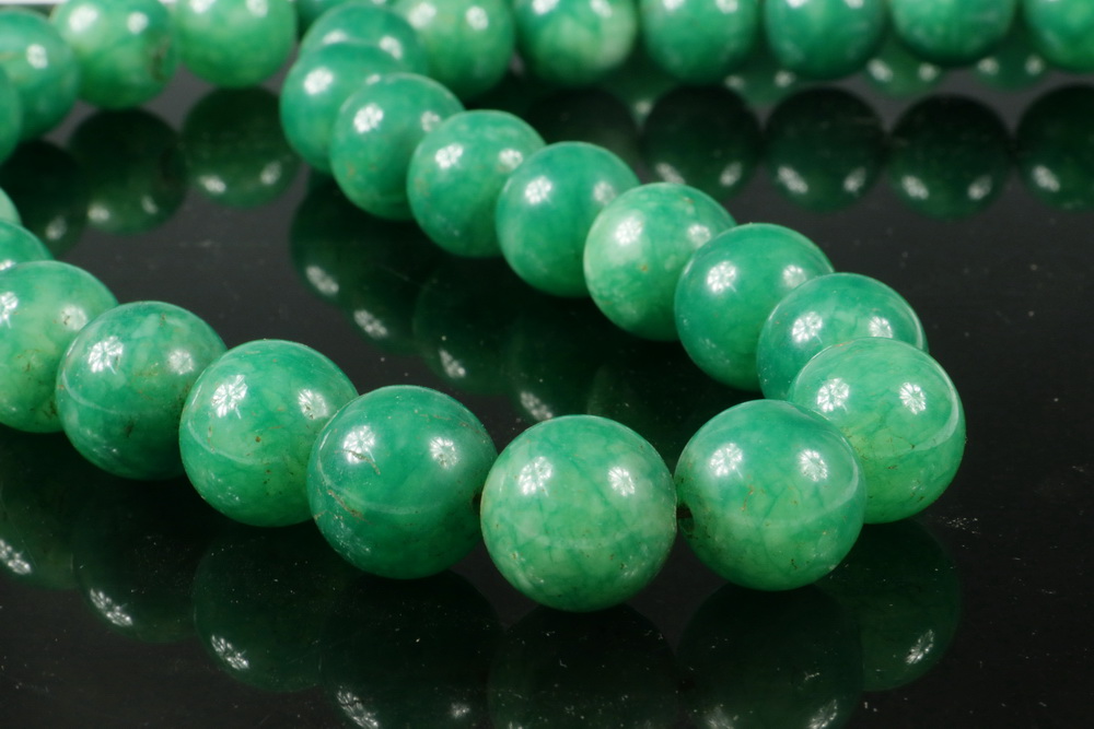 Appraisal: JADE PRAYER BEADS Strand of Green Jade Beads each diam