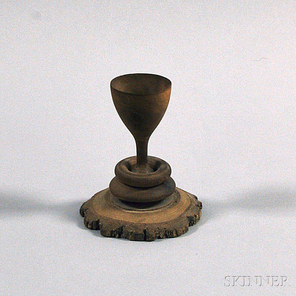 Appraisal: Turned Wooden Cup with ring carved around stem ht in