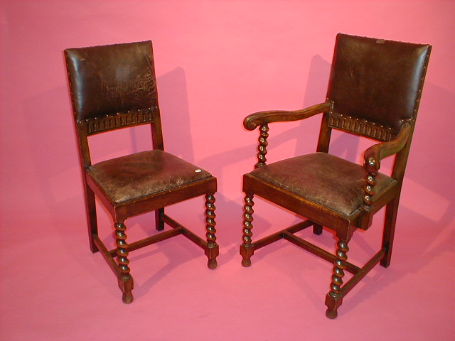 Appraisal: A set of six barleytwist oak panel back dining chairs