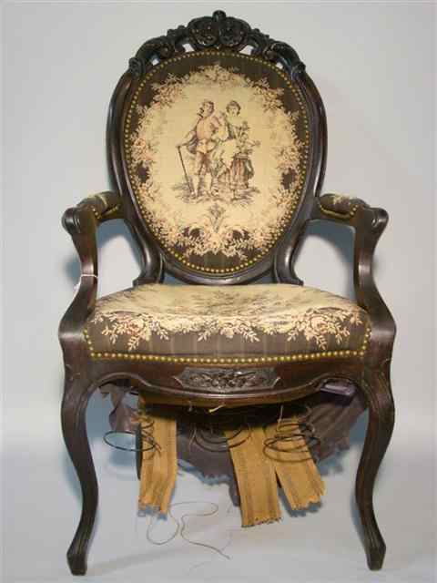 Appraisal: VICTORIAN WALNUT TAPESTRY UPHOLSTERED ARMCHAIR circa the carved crest above