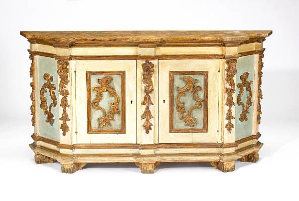 Appraisal: An Italian Baroque paint decorated and parcel gilt credenza Tuscany