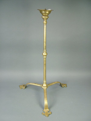 Appraisal: A th century gothic style brass candlestick base on three