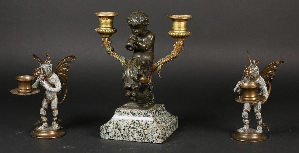 Appraisal: bronze flying monkey candlesticks with brass wings and masks Bronze