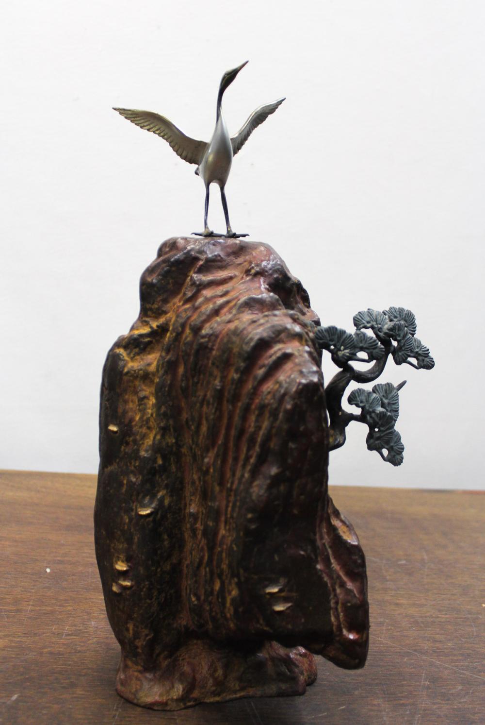 Appraisal: JAPANESE POLYCHROME BRONZE SCULPTURE featuring a crane with wings outspread