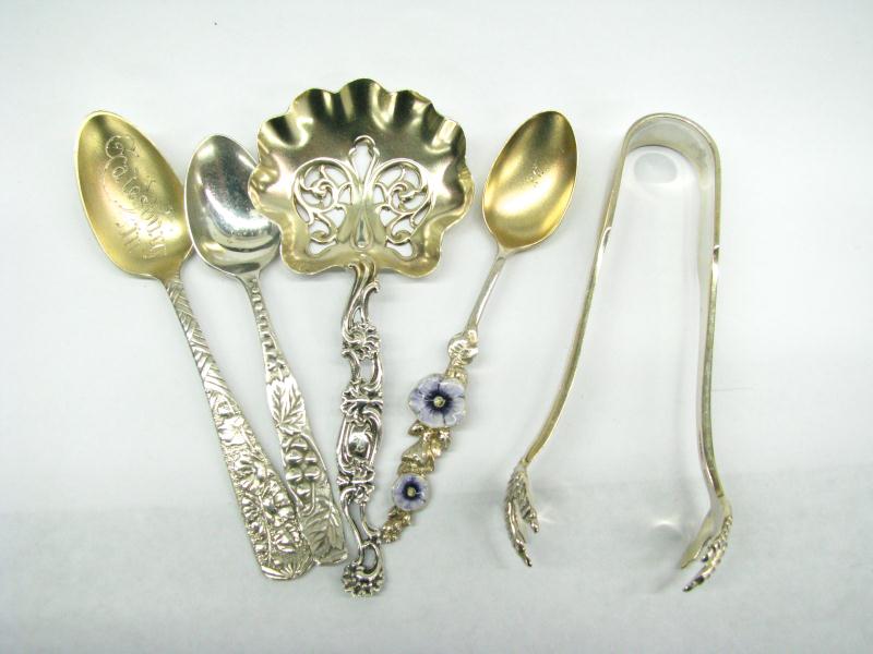 Appraisal: Group of twenty-eight assorted spoons and pickle tongs including floral