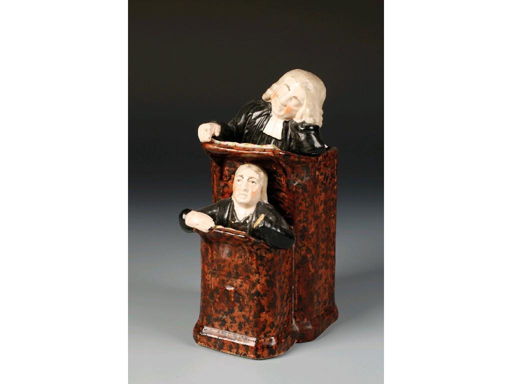 Appraisal: A STAFFORDSHIRE POTTERY GROUP THE VICAR AND MOSES with overglaze