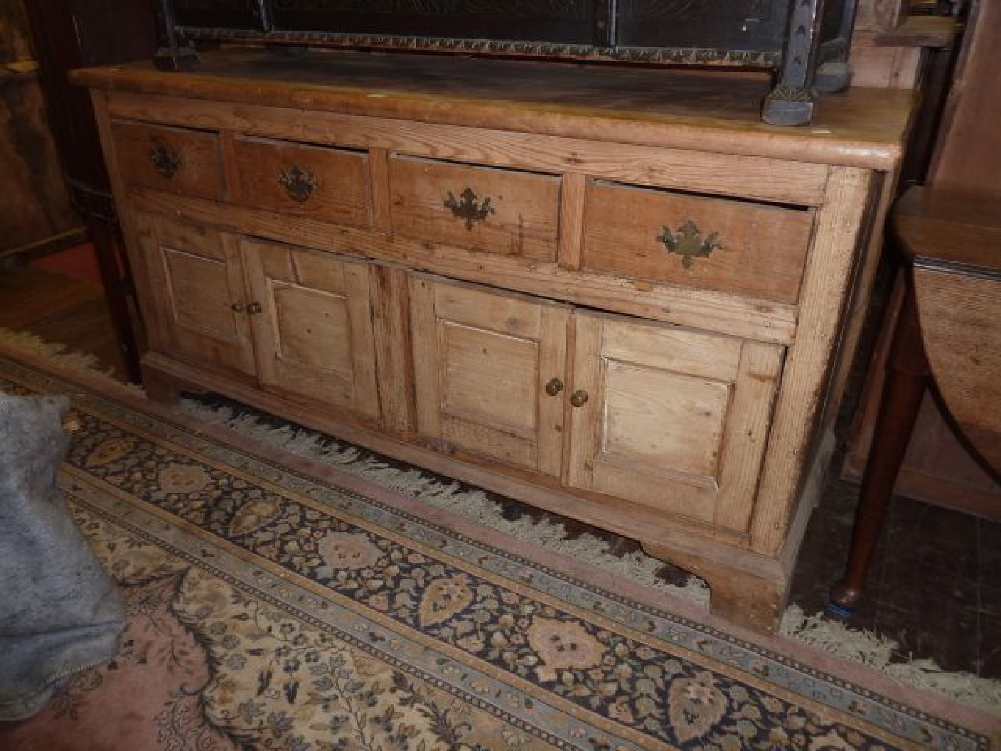 Appraisal: A th century stripped and waxed pine dresser base fitted