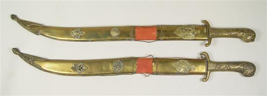 Appraisal: Pair of Persian Swords th Century Ornate brass scabbard and