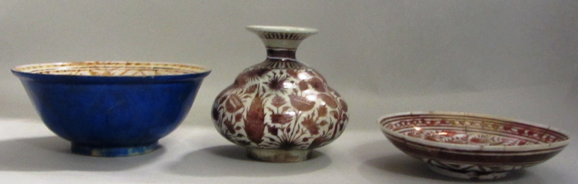 Appraisal: Three Safavid lustre pottery vessels Iran th century comprising a