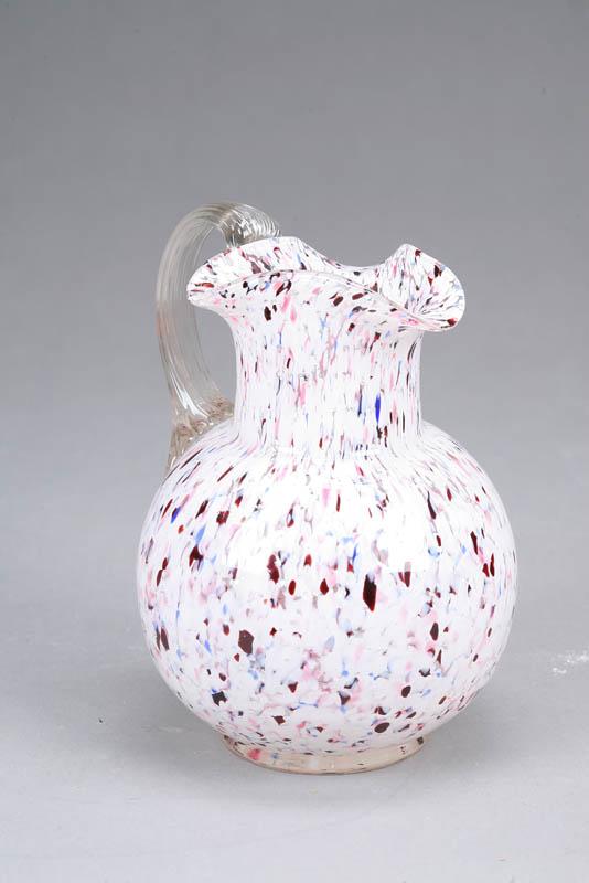 Appraisal: GLASS PITCHER Footed spatter glass pitcher with a ruffled rim