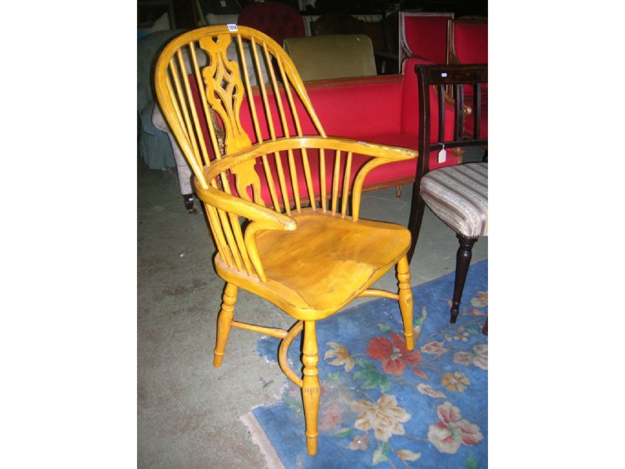 Appraisal: A Windsor hoop and stickback elbow chair with central pierced