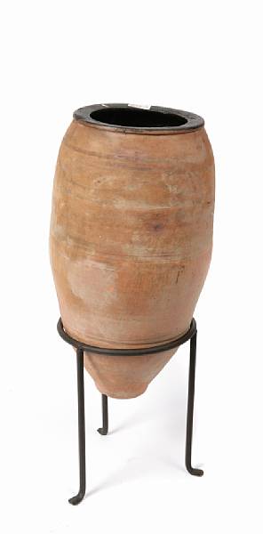 Appraisal: A Mediterranean earthenware olive jar with stand height in diameter