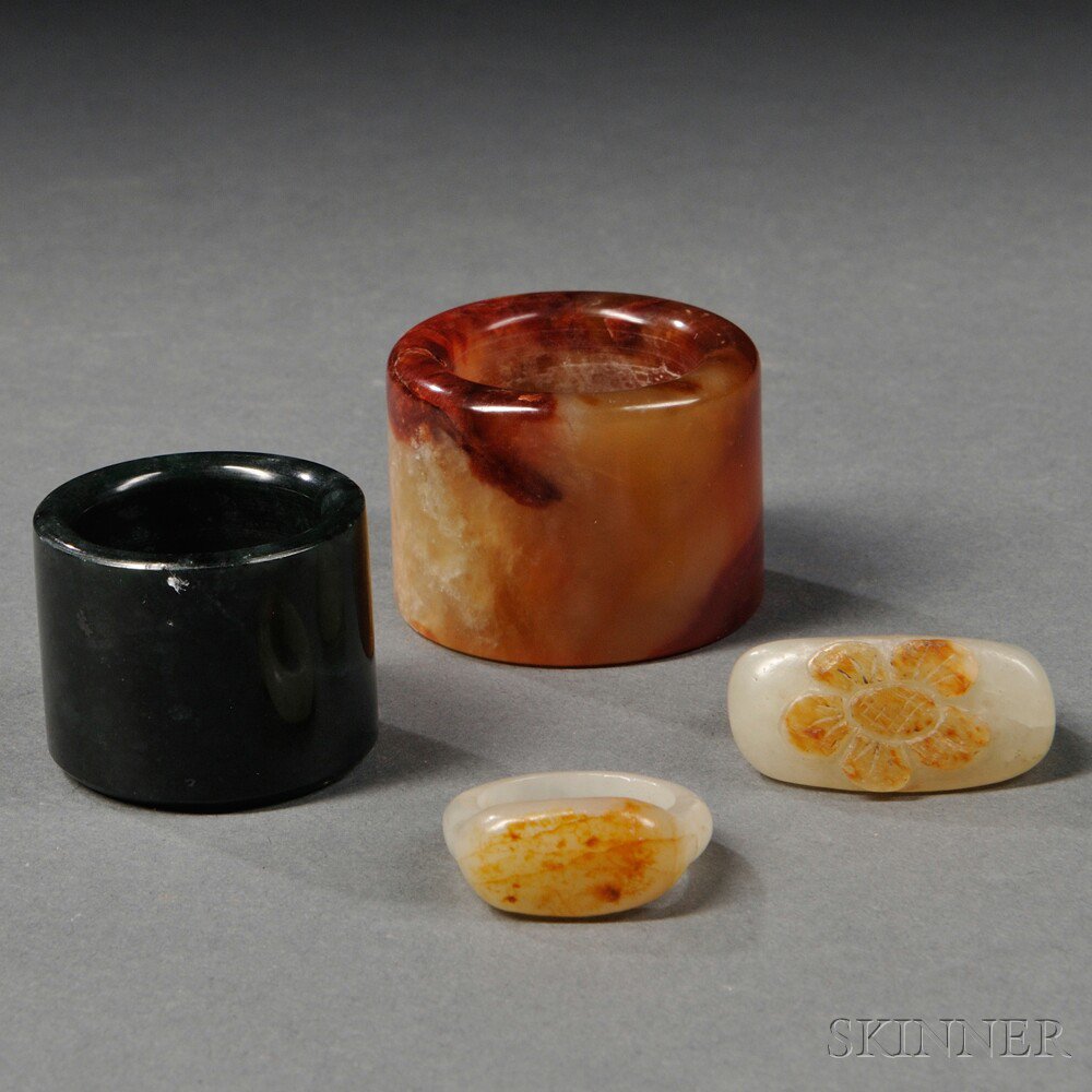 Appraisal: Four Hardstone Rings China th century two archer's rings with