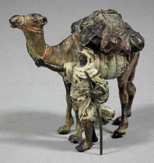 Appraisal: A small cold painted bronze figure of an Arab with