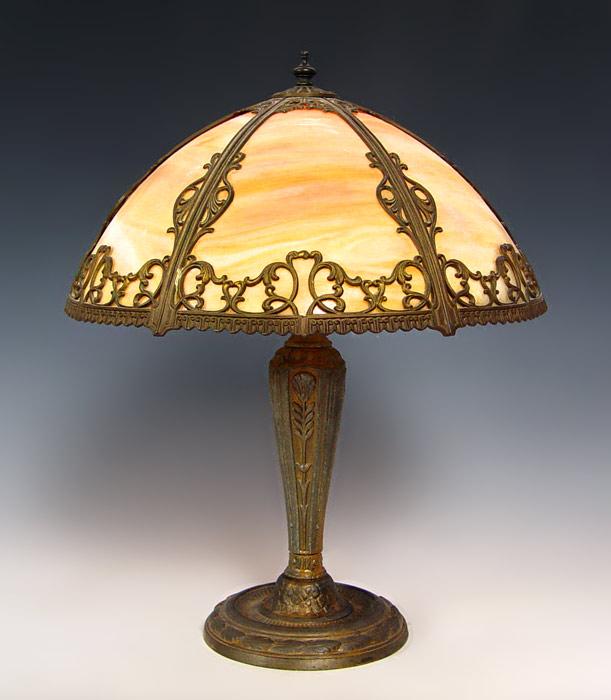 Appraisal: VINTAGE CARAMEL SLAG GLASS TABLE LAMP Six glass panel filigree