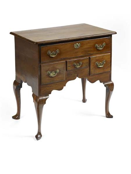 Appraisal: A mid th century yew-wood lowboy the rectangular top with