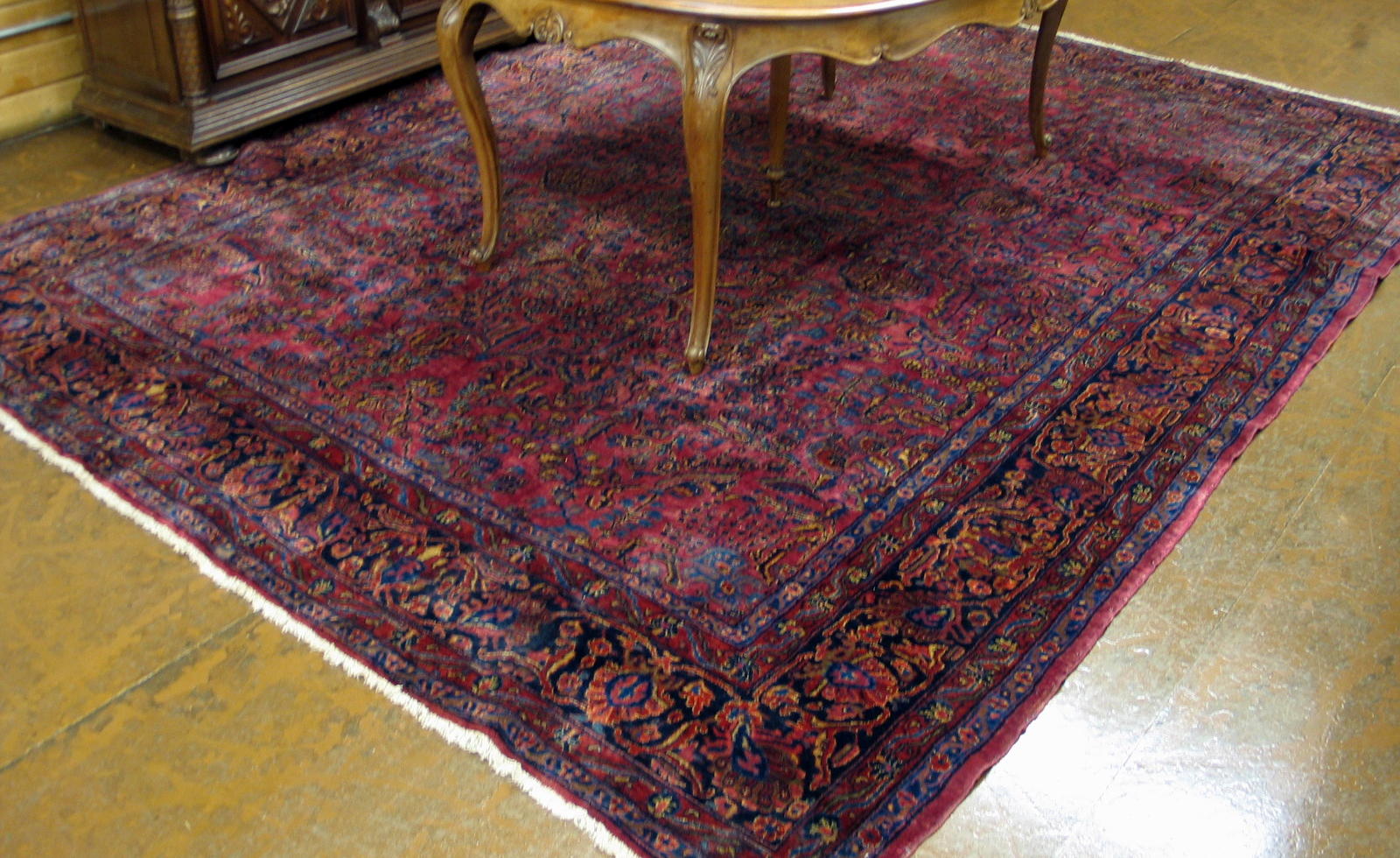 Appraisal: SEMI-ANTIQUE PERSIAN SAROUK CARPET overall floral design on deep burgundy