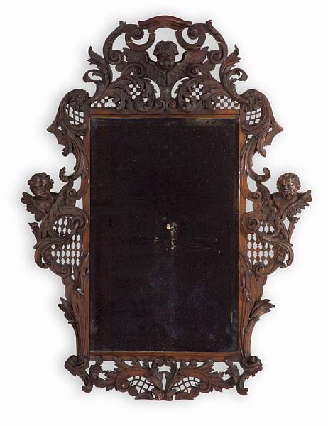 Appraisal: A German Baroque style walnut mirror late th century The