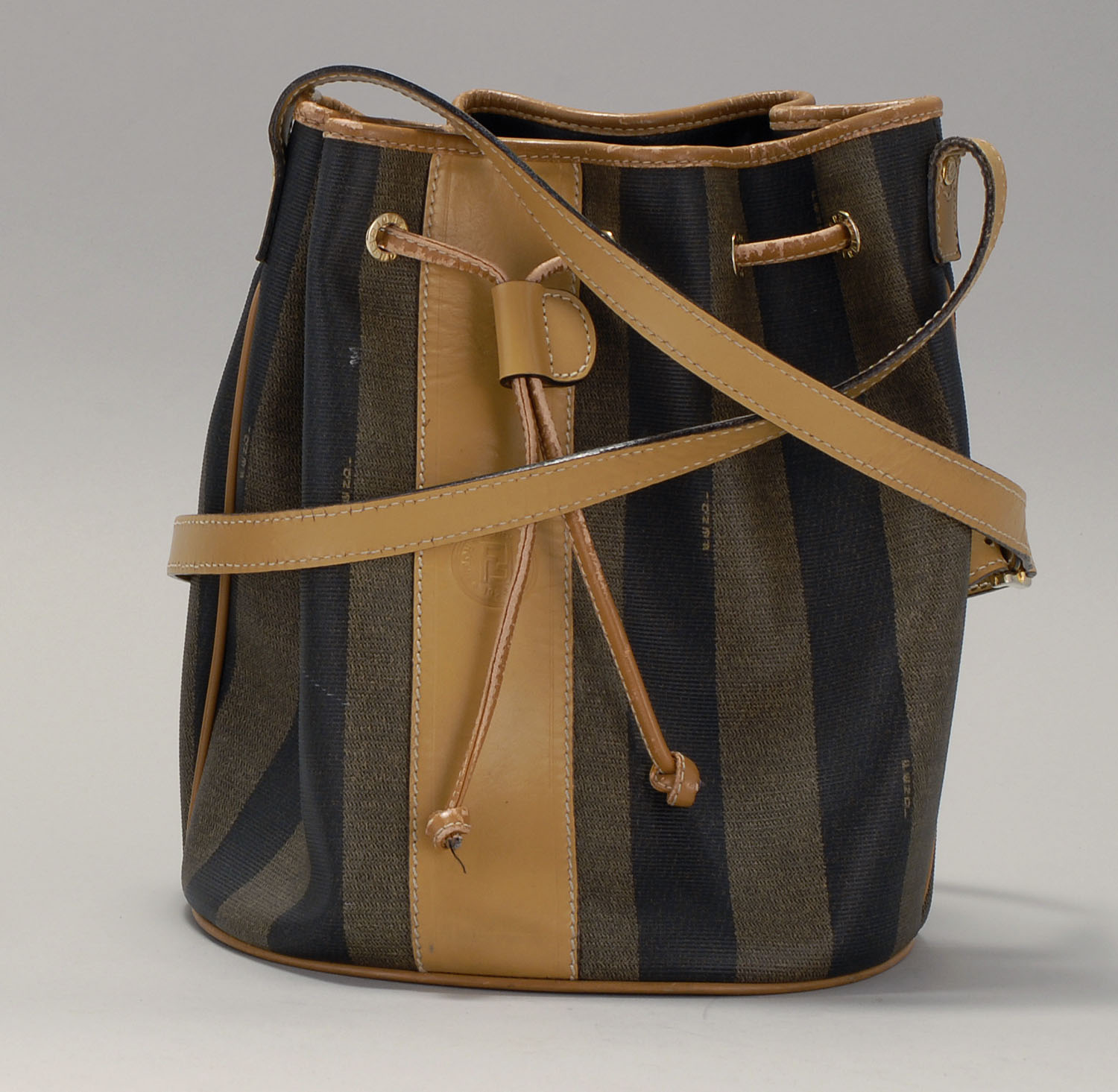 Appraisal: FENDI DRAWSTRING BUCKET HANDBAG With tan leather strap and front