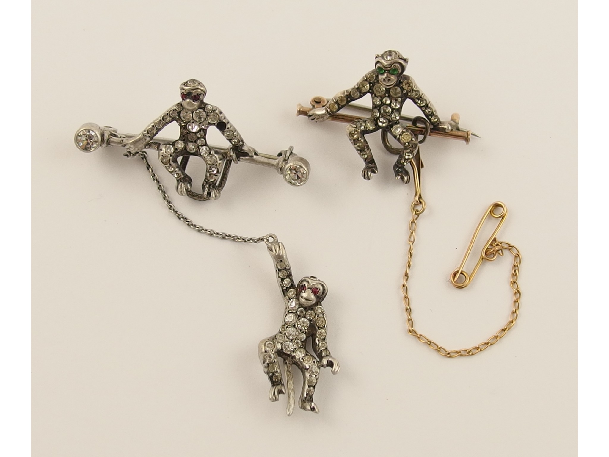 Appraisal: Two monkey broochesmade in yellow and white metal set throughout