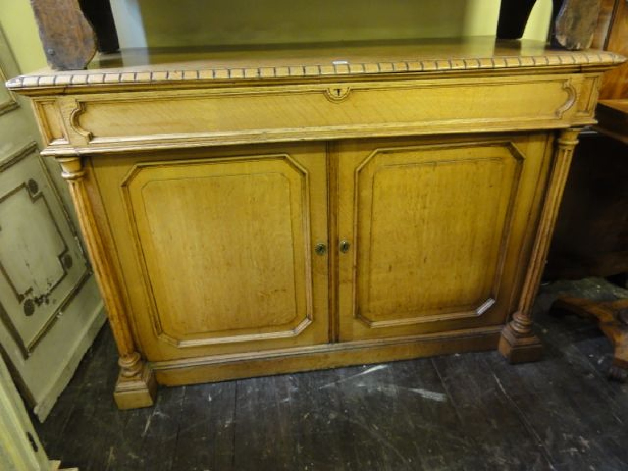 Appraisal: A mid-Victorian pale oak side cabinet enclosed by a pair