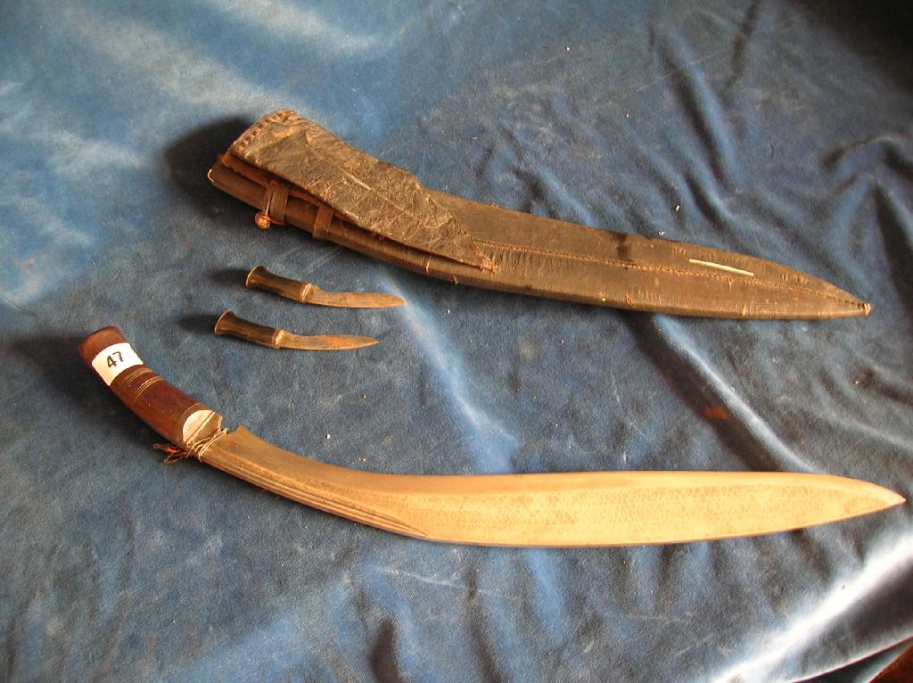 Appraisal: A large th century Nepalese kukri with long blade and