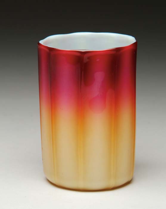 Appraisal: PLATED AMBERINA TUMBLER Fuchsia shading to amber with vertical ribbing