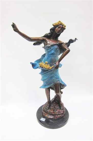 Appraisal: POLYCHROME BRONZE SCULPTURE depicting a woman in a flowing dress