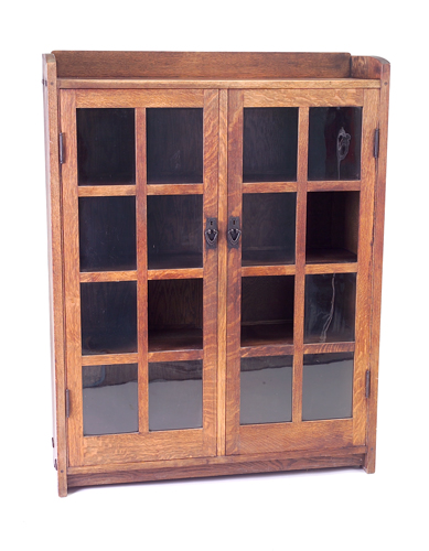 Appraisal: GUSTAV STICKLEY Two-door bookcase no with gallery top eight panes