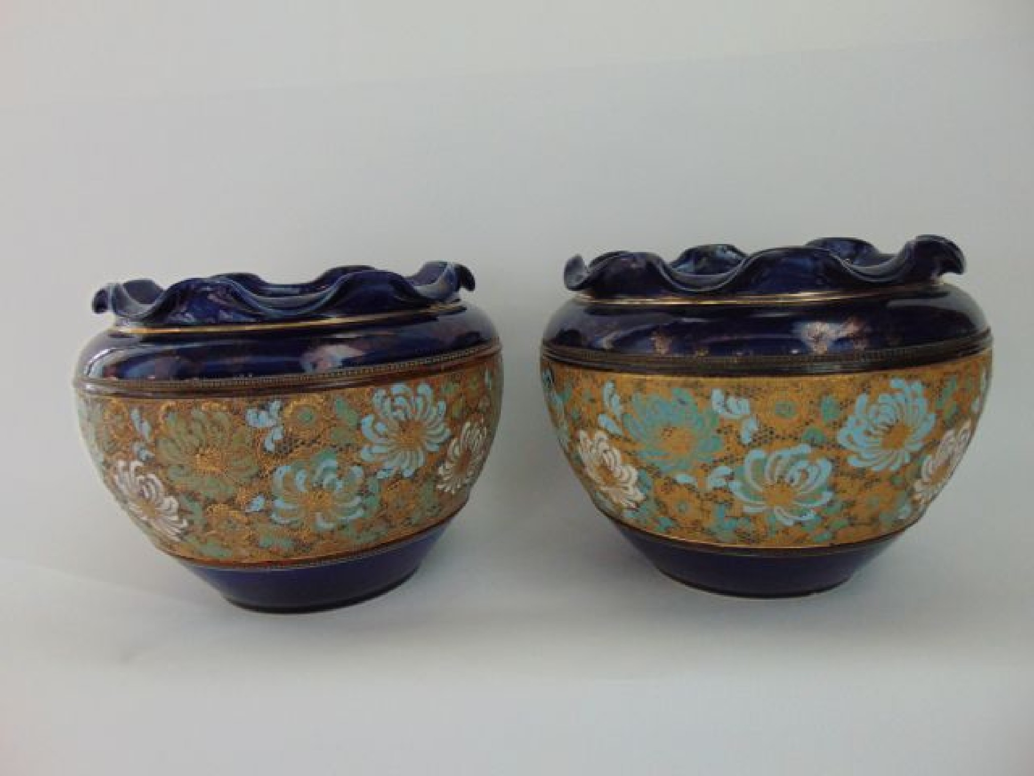 Appraisal: A pair of Doulton Lambeth Slaters jardinieres with turquoise white