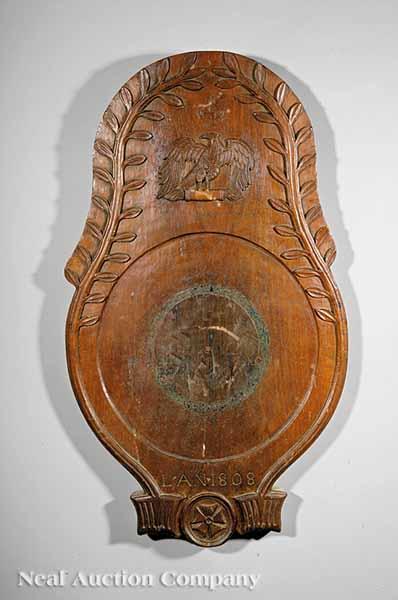 Appraisal: An Empire Carved Walnut Relief Plaque inscribed L'An borders of