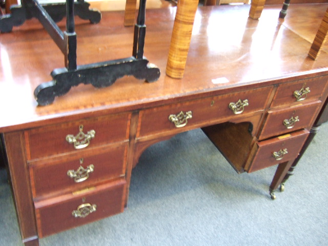 Appraisal: An Edwardian mahogany and satinwood banded dressing table with seven