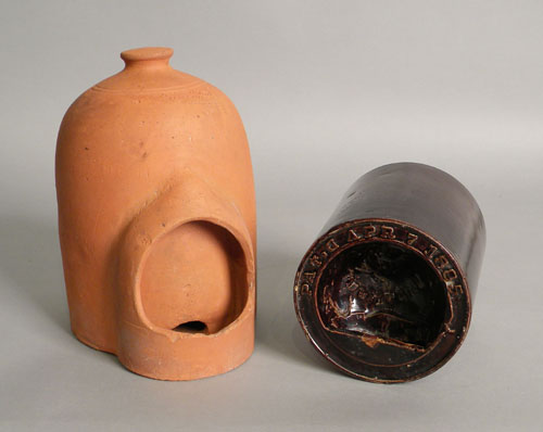 Appraisal: Two earthenware chicken feeders the redware piece stamped Geo F