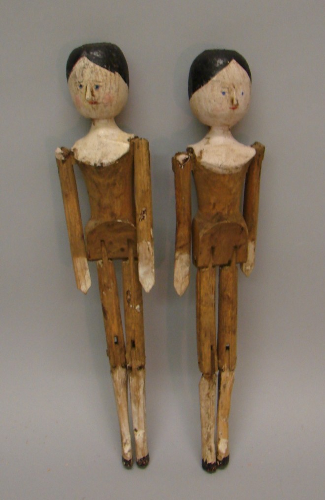 Appraisal: Pair of early Peg Wooden dolls Carved noses no side