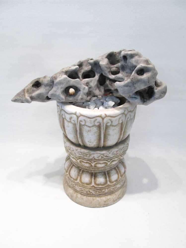 Appraisal: CHINESE SCHOLAR ROCK WITH MARBLE BASIN the pierced gray stone