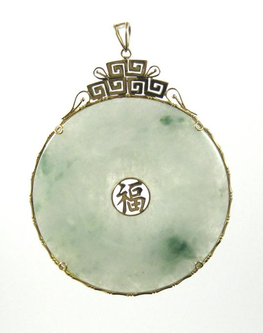 Appraisal: CHINESE JADEITE AND FOURTEEN KARAT GOLD PENDANT The large pendant