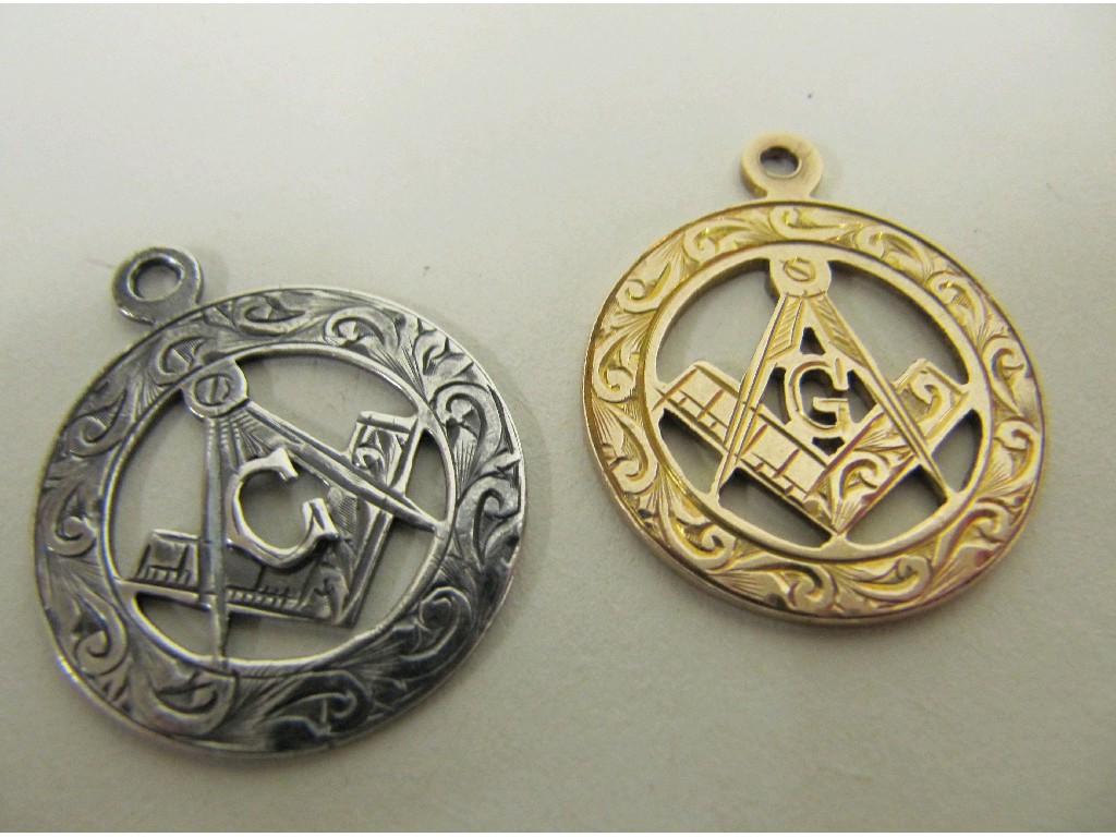 Appraisal: Lot comprising a silver and a ct gold Masonic fobs