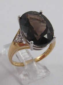 Appraisal: A carat gold dress ring set with smokey quartz