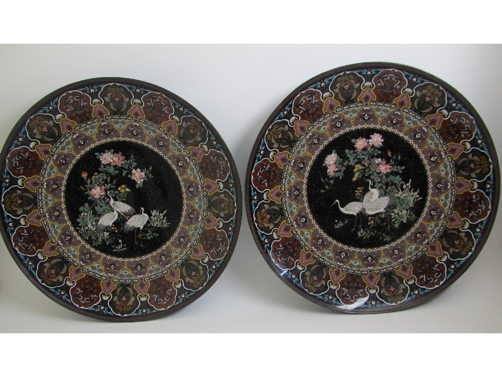 Appraisal: A pair of Japanese cloisonne plaques decorated with cranes amongst